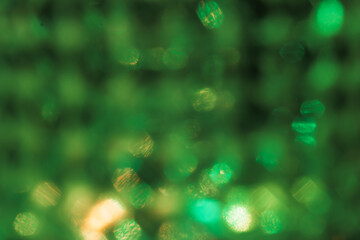 Green bokeh effect, photo for cover design, festive New Year background image, Christmas decoration