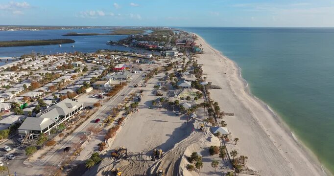 Hurricane Milton aftermath cleanup. Sand recipient site for residents to dump sand after storm surge. Huge sand piles at Englewood Beach on Manasota Key.