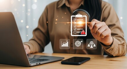 Professional woman analyzing data on laptop and digital clipboard