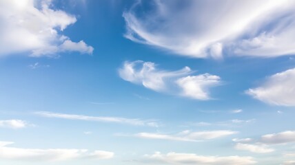 Fototapeta premium Dynamic White Clouds Drifting Across a Vivid Blue Sky nature