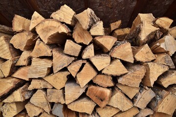 A woodpile in a shelter, ready for wood burning during winter