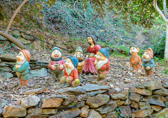Snow White and Seven Dwarfs Garden Statues in Forest Setting