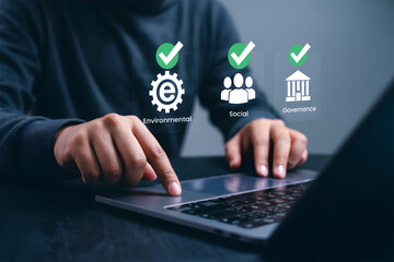 ESG Criteria and Sustainability: Man Checking Virtual Environmental, Social, Governance Icons on Laptop