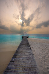 Tranquil closeup calm sea water waves with palm trees. Beautiful Sunset Panorama, Tropical island beach landscape exotic shore coast. Summer vacation, holiday amazing nature. Relax paradise, Maldives.