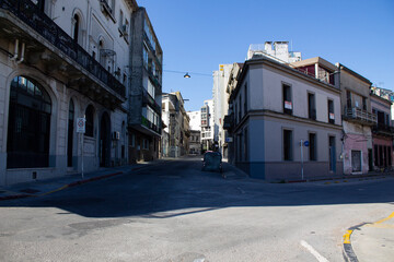 Narrow street in the old Uruguayan city of Montevideo with urban architecture and buildings