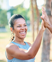 Smiling active young couple jogging exercising and having fun and laughing together taking a break...