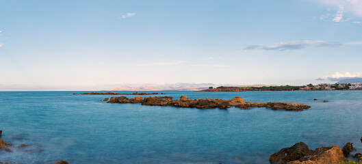 Coastal Panorama of Rocky Shore and Blue Sea at Sunset  Chania Crete