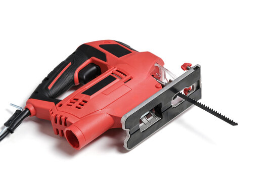 Red electric jigsaw on white background.