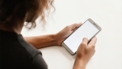 Individual using smartphone with blank screen at indoor setting