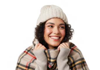 A smiling woman wearing a knitted beanie and a plaid scarf, looking to the side, isolated on transparent background