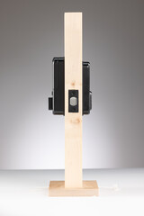 Modern beige and black electronic device on a stand