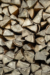 Fototapeta premium Texture of Firewood Prepared for Stove Heating, Natural Abstract Brown Background