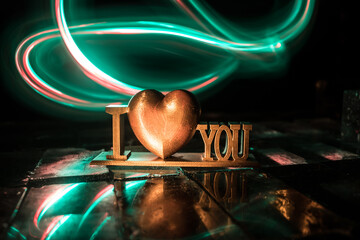 A Miniature Table Scene with Items Symbolizing Love, Relationships, and Romance, Including a Heartfelt Love Card, Perfectly Capturing the Spirit of Valentine’s Day.