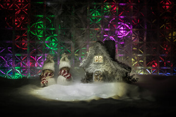 Christmas home decoration with snow and tree on a dark background with copy space. Selective focus. New Year attributes on background