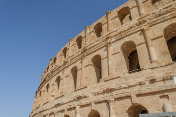 Obraz premium Arched Tiers of the El Jem Amphitheatre against Blue Sky, Tunisia