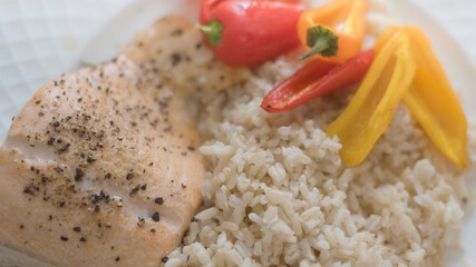 Baked salmon with rice and colorful vegetables