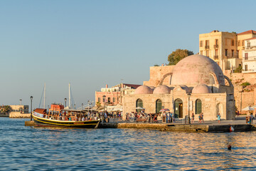 Naklejka premium Kucuk Hasan Mosque and Venetian Harbor in Chania at Golden Hour, Crete, Greece