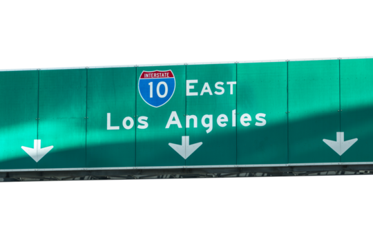 Los Angeles Interstate 10 east freeway arrow sign with light streak.  Isolated with cut out background.