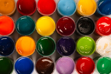 Gouache colorful paints set. Jars of gouache paint isolated on a white background.