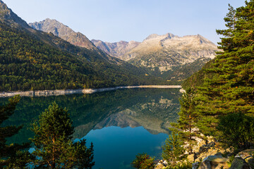 Panoramic view of Lake Orédon reflecting the mountains of the Néouvielle Nature Reserve