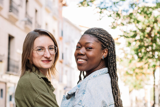 Multiethnic women smiling looking at camera outdoors