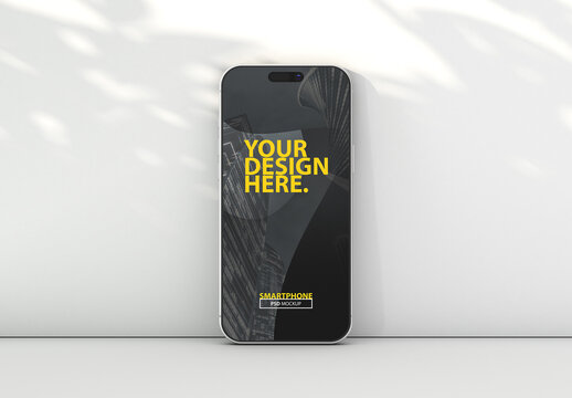 Smartphone screen Mockup near wall with shadows from plant for UI Design