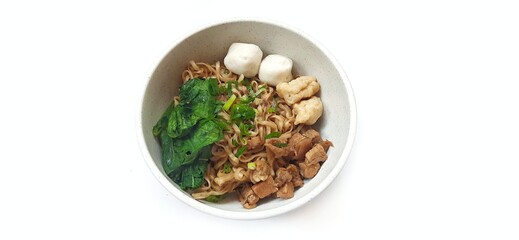 Mie Ayam Indonesian Chicken Noodle Soup with Fish Balls in a Bowl Isolated on White Background. Food Photography