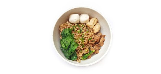 Mie Ayam Indonesian Chicken Noodle Soup with Fish Balls in a Bowl Isolated on White Background. Food Photography
