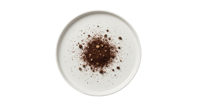 Heap of cocoa powder on white plate - food ingredient and culinary concept
