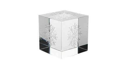 Clear glass cube with frosted snowflake design on black background