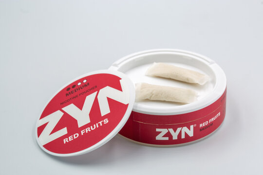 ZYN nicotine pouches red fruits medium strength container closeup.