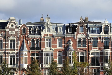 Fototapeta premium Weesperzijde Ornate Brick House Facades in Amsterdam, Netherlands