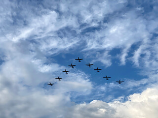 Nine Airplanes Flying Among the Clouds
