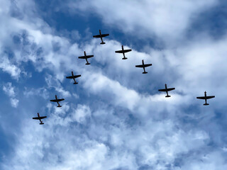 Nine Airplanes Flying Among the Clouds