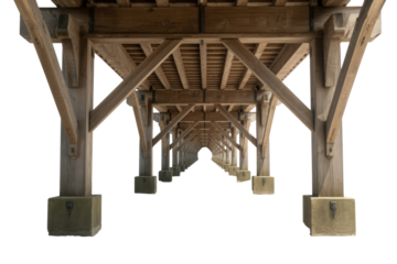 Underside view of a long wooden pier or bridge structure, featuring repetitive columns, beams, and diagonal supports creating a strong perspective. background removed