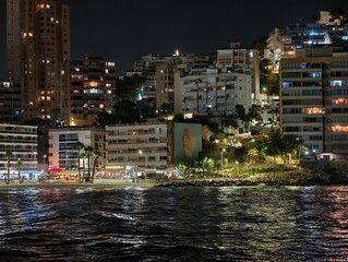 vibrant harbor scene, energetic waterfront district featuring shimmering waters and illuminated