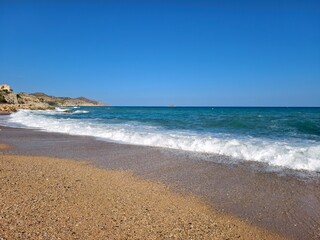 peaceful seaside with soothing waves, tranquil coastal scene with warm hues and gentle waves