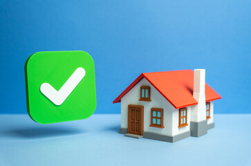 Home and check mark. Verified house. Bed and breakfast reservation. Choosing a home to buy. Real estate market, online booking, and digital approval. Concept of trust, housing, property verification.