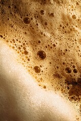 Close up of frothy coffee or beer foam bubbles for beverage texture background