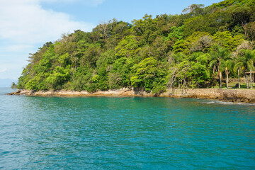 Beautiful view of Brazilian coast. green sea waters and small island with lush tropical vegetation