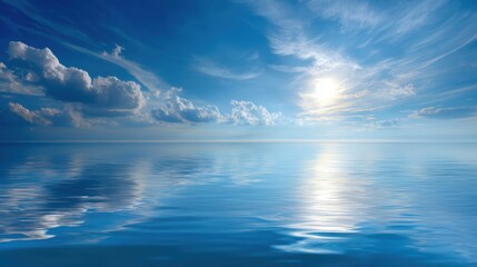 Obraz premium Serene Ocean Landscape With Bright Blue Sky and Gentle Clouds Reflecting on Calm Water Surface Under a Radiant Sunlight