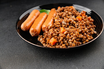 Lentils with sausage second course quick meal natural tasty appetizer fresh delicious gourmet food background on the table rustic top view copy space
