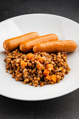 Lentils with sausage second course quick meal natural tasty appetizer fresh delicious gourmet food background on the table rustic top view copy space
