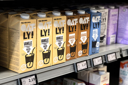 10.28.2025 - Flensburg, Germany. Oatly vanilla and chocolate plant-based milk on a shelf of a supermarket