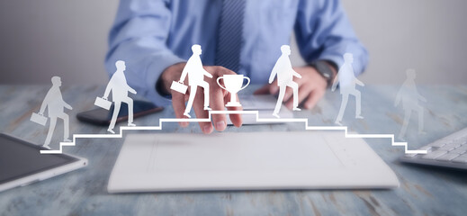 Businessman walking on stairs. Walking down stairs after reaching the trophy