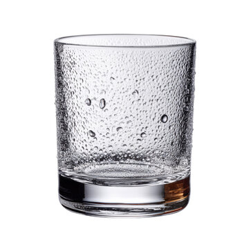 An empty, textured glass tumbler covered in condensation droplets, featuring a thick base, on a solid transparent background. background removed