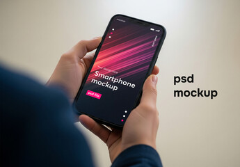 Smartphone mockup held in hands on pastel background