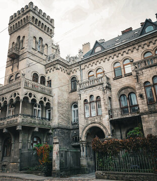 Lviv, old town, historic building, Sosnovsky Palace, architecture, street view, cityscape, heritage, turrets, castle style, vintage facade, European city, tourist attraction, urban scene, cultural lan