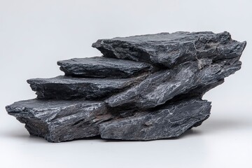 Stack of Dark Gray Slate Rocks on White Background for Interior Design or Landscaping