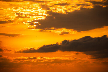 Golden sunrise sky with clouds
